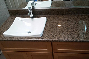 Tropic Brown Granite Bath with Top-mount Sink.